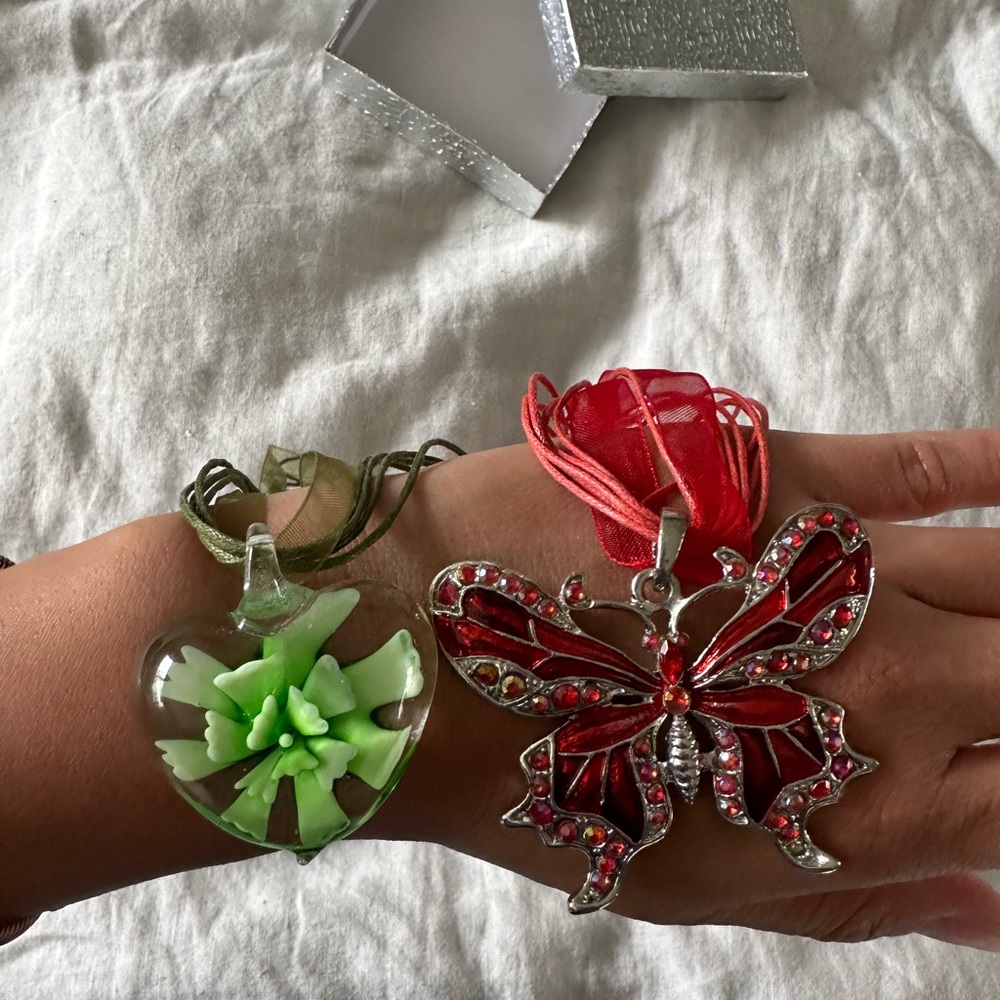 Green glass heart and red butterfly necklace